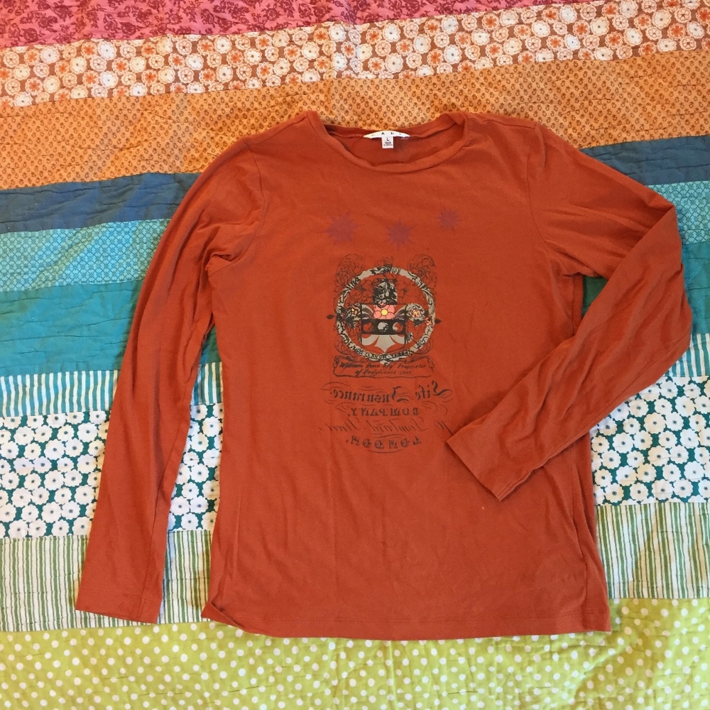CAbi Playful Fleur De Lis Orange Tee